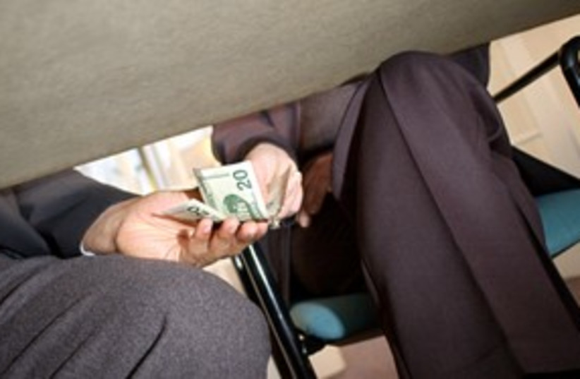 money under the table corruption 311 (photo credit: Thinkstock/Imagebank)