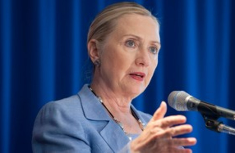 US Secretary of State Hillary Clinton 311 (R) (photo credit: REUTERS/Saul Loeb/Pool)