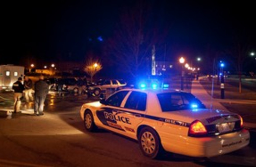 Police at the scene of Virginia Tech shooting 311 (R) (photo credit: REUTERS/Chris Keane )