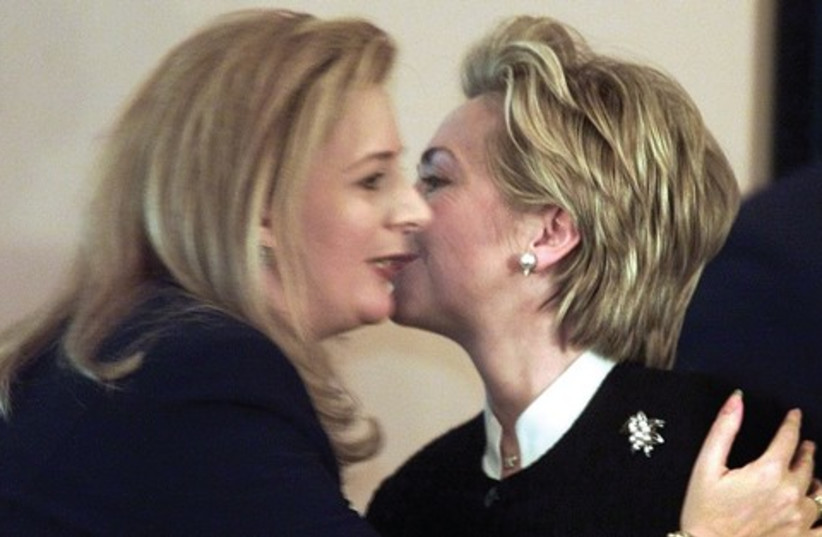 Hillary Clinton kissing Suha Arafat 521 (photo credit: Reuters)