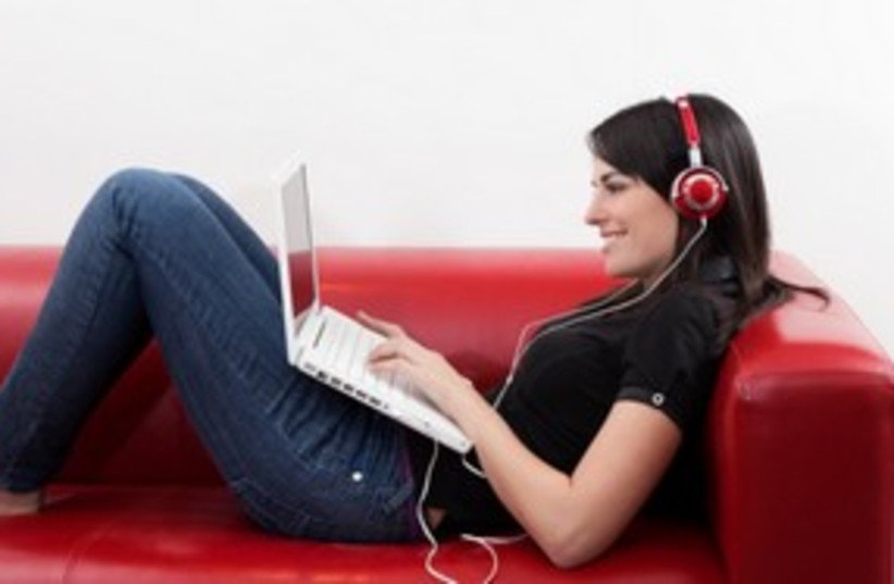 Girl listening to music 311 (photo credit: Thinkstock/Imagebank)