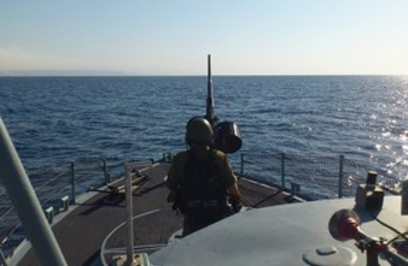 Sailor mans cannon during routine patrol of Red Sea 311 (photo credit: Yaakov Katz)