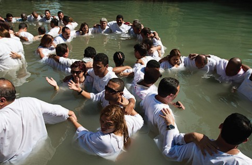 Baptisim ceremony 521 (photo credit: AMIR COHEN / REUTERS)