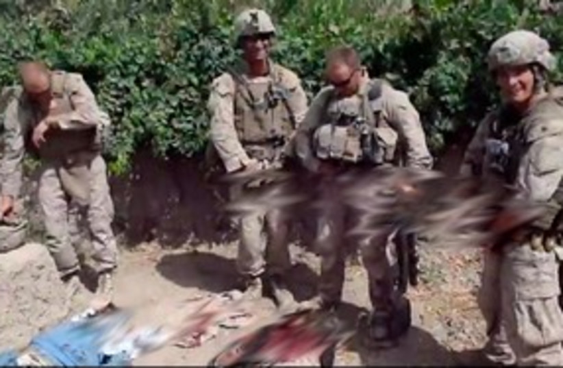 Screencap: Video of Marines urinated on Taliban corpses 311 (photo credit: YouTube )