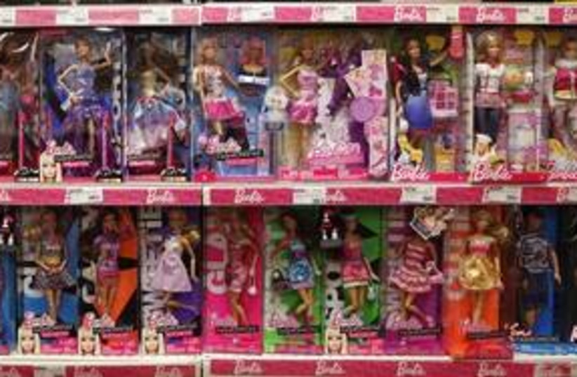 Barbie dolls displayed in a toy store 311 (R) (photo credit: Eric Gaillard / Reuters)