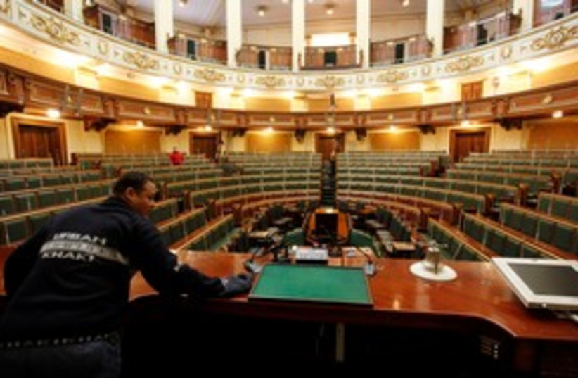 Worker prepares Egypt's parliament in Cairo 311 (R) (photo credit: REUTERS/Mohamed Abd El-Ghany)