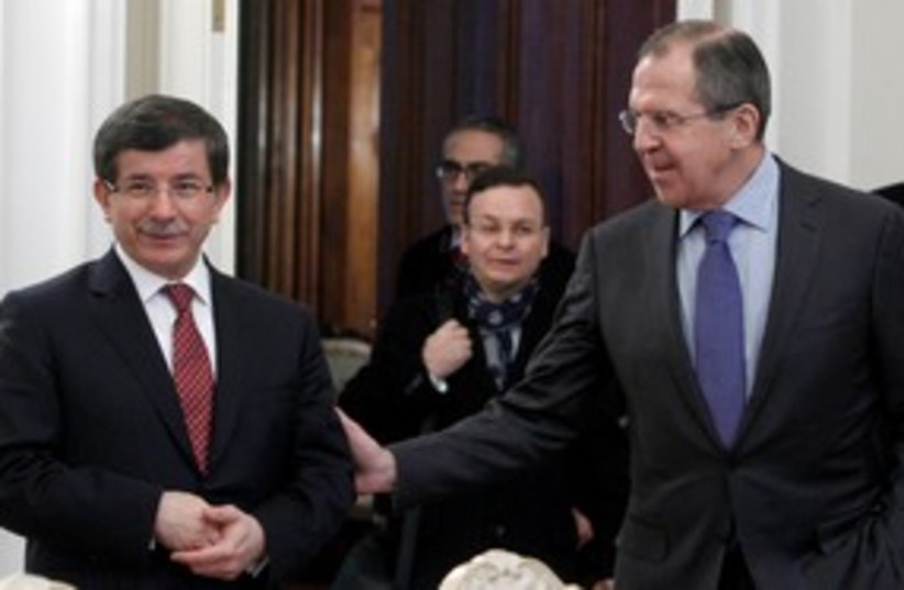 Russian FM Lavrov with Turkish FM Davutoglu 311 (R) (photo credit: REUTERS/Sergei Karpukhin)