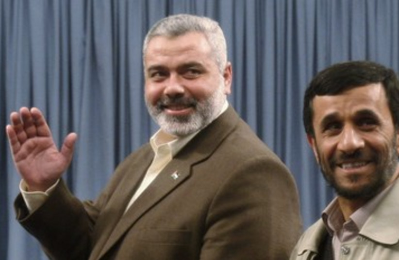 PM Haniyeh and Iranian President Mahmoud Ahmadinejad 390 (photo credit: REUTERS/Suhaib Salem)