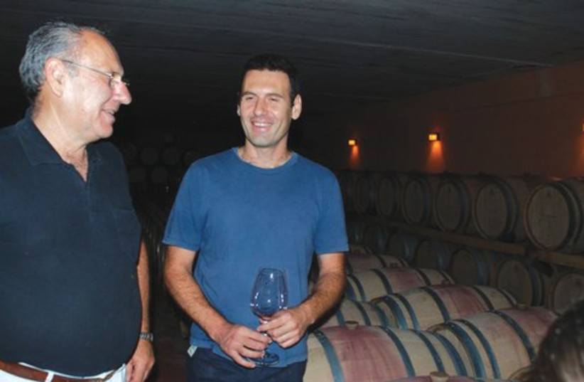Israel and Golan Flam in their vineyard 521 (photo credit: Courtesy)