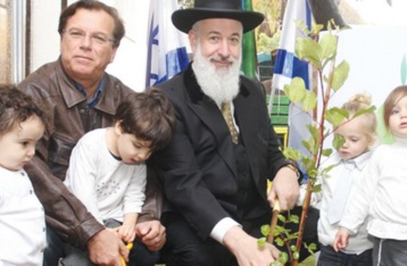 Rabbi  Metzger, JNF Chairman Stenzler plant trees (photo credit: Ancho Gosh)