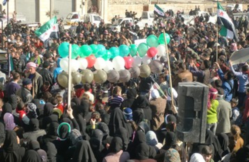 Syrian demonstrate against Assad 390 R (photo credit: REUTERS)