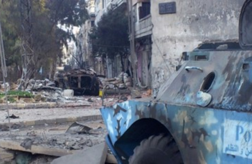 Military vehicle seen in Syria, Homs_390 (photo credit: Reuters)