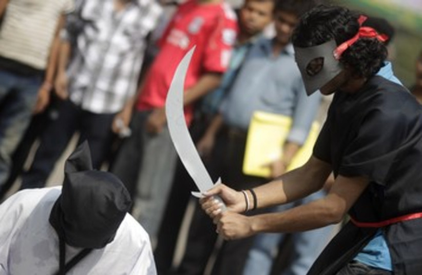 Mock execution in Bangladesh 390 (photo credit: REUTERS/Andrew Biraj)