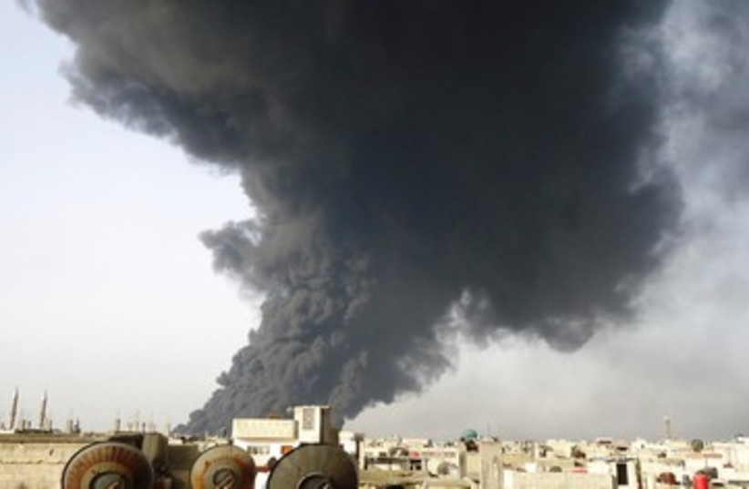 Smoke rising from Syria oil pipeline 390 (photo credit: REUTERS/Handout)