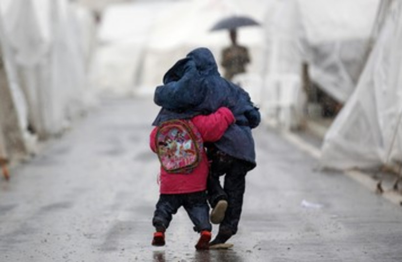Syrian boys in Turkish refugee camp_390 (photo credit: Reuters)