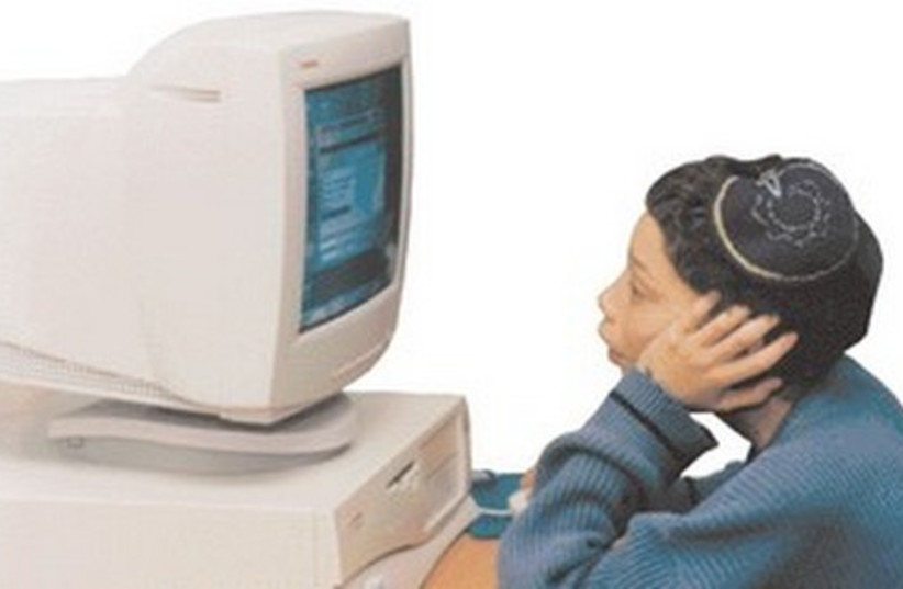 Boy using computer 521 (photo credit: courtesy)