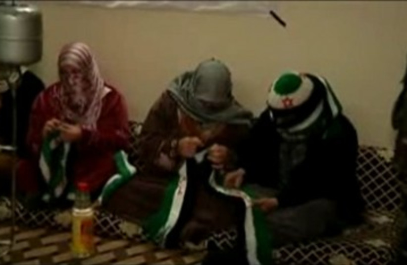 Syrian Arab women knitting rebels 390 (photo credit: REUTERS)
