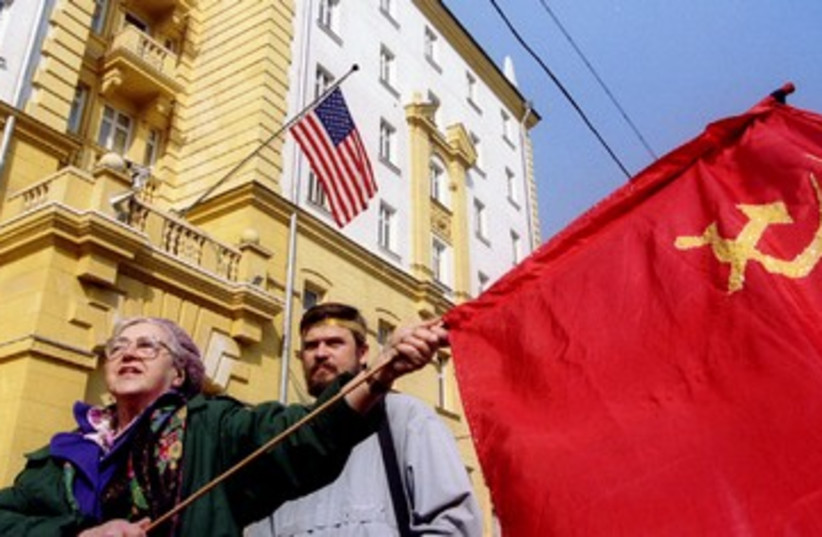 Soviet sympathizers wave flag 390 (photo credit: REUTERS)