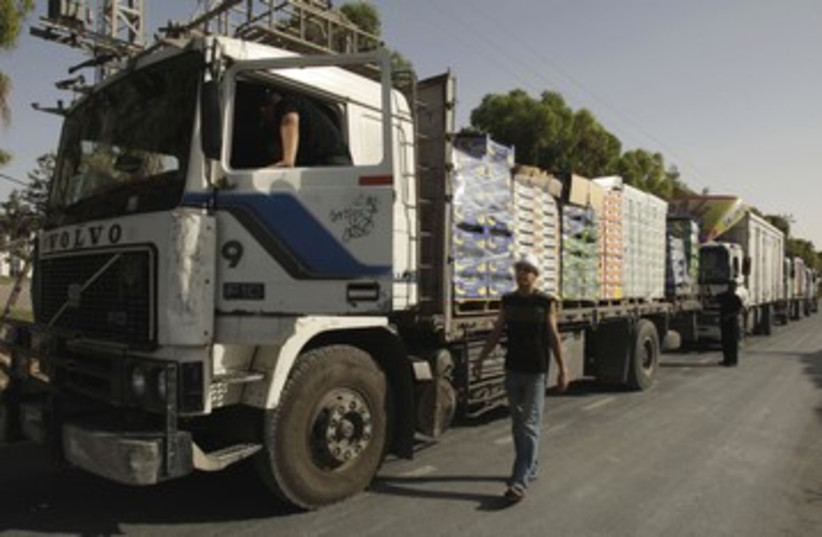 Trucks at the Kerem Shalom Crossing in Gaza 390 (R) (photo credit: Ibraheem Abu Mustafa / Reuters)