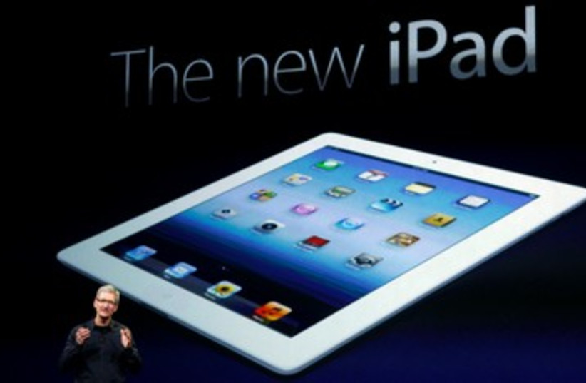 Apple CEO Tim cook unveils new iPad 390 (photo credit: REUTERS/Robert Galbraith )