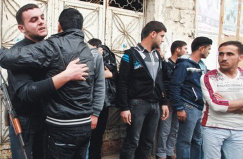 Palestinians after funeral of terrorist 390 (photo credit: Suhaib Salem/Reuters)