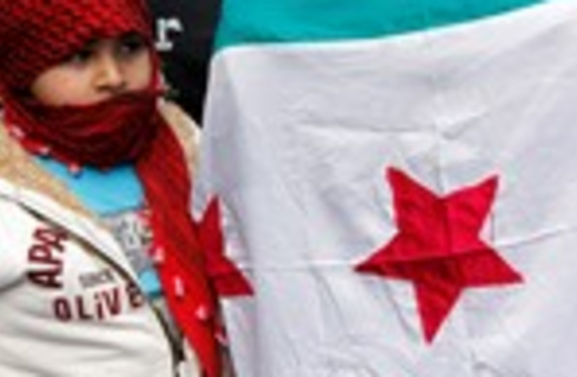 Child near Syria opposition flag 150 (photo credit: MOHAMED AZAKIR)
