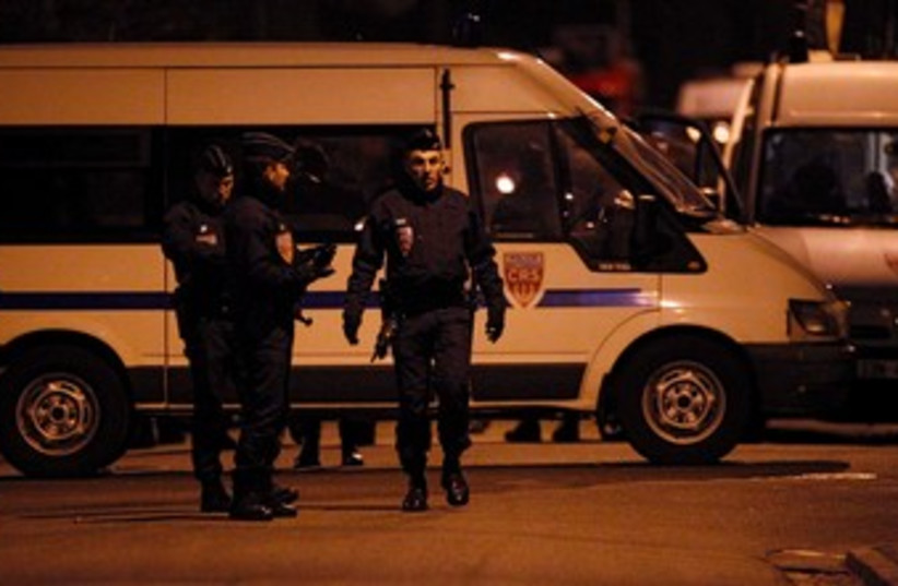 French police at scene of Toulouse standoff 370 (R) (photo credit: REUTERS/Jean-Paul Pelissier)