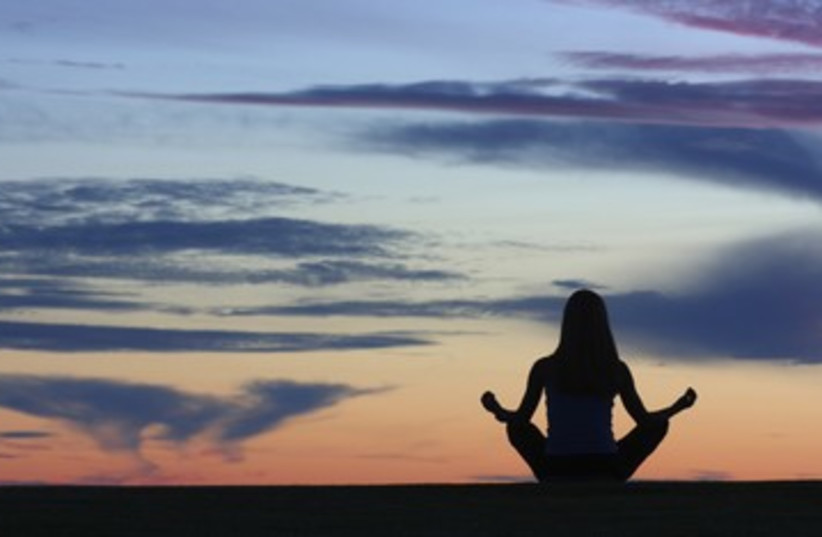 Woman meditating meditation 390 (photo credit: Thinkstock/Imagebank)