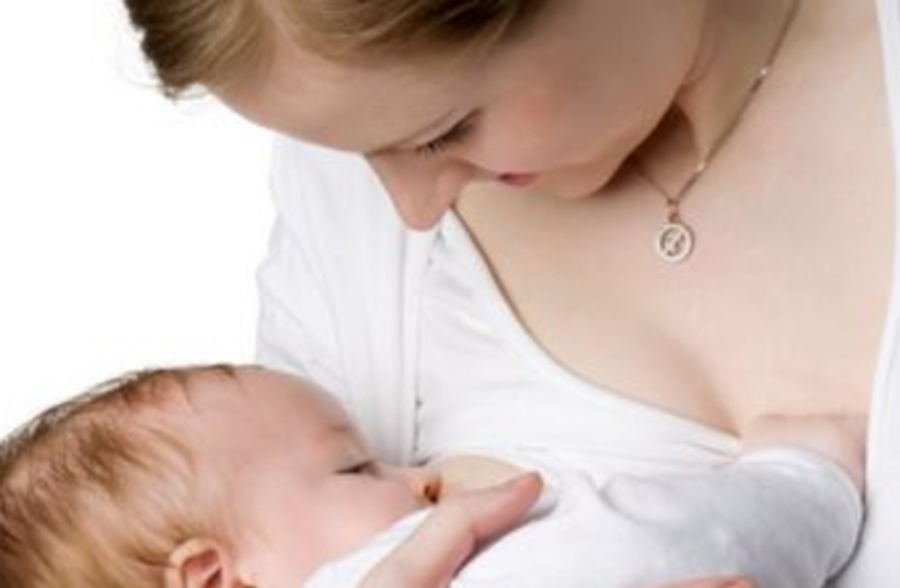 A woman breastfeeding 370 (photo credit: Thinkstock/Imagebank)