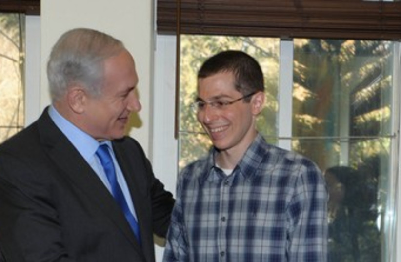 PM Netanyahu and Gilad Schalit in Tel Aviv 370 (photo credit: Moshe Milner / GPO)