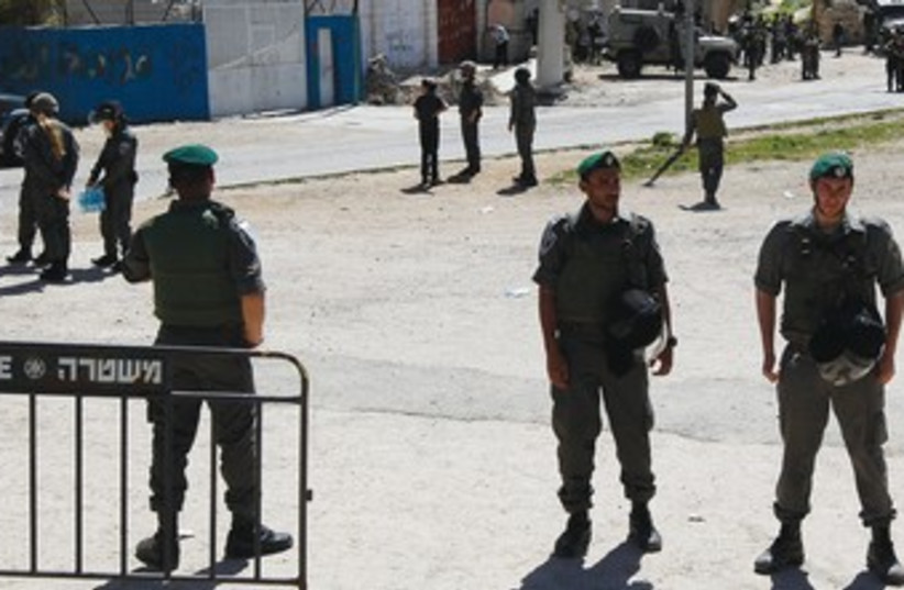 BORDER POLICEMEN at Beith Hamahpela 370 (photo credit: Reuters)