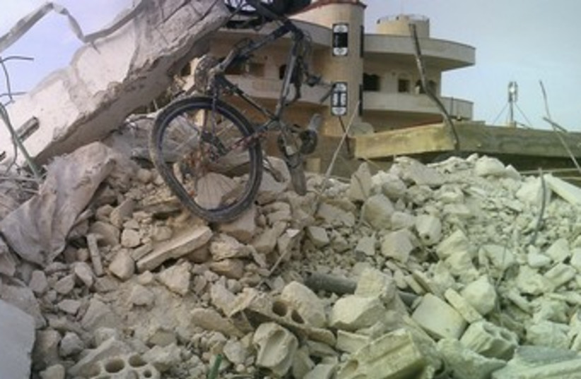 Damaged building in Taftanaz village, east of Idlib R 370 (photo credit: REUTERS)
