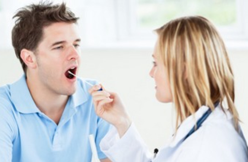 nurse checks a mouth (photo credit: Thinkstock/Imagebank)