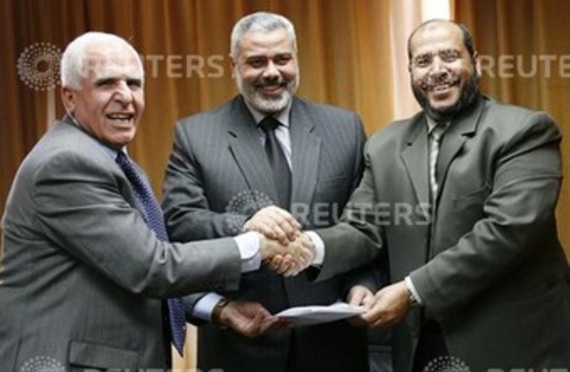 DEPUTY PALESTINIAN Prime Minister Azzam al-Ahmed (left) (photo credit: Suhaib Salem / Reuters)