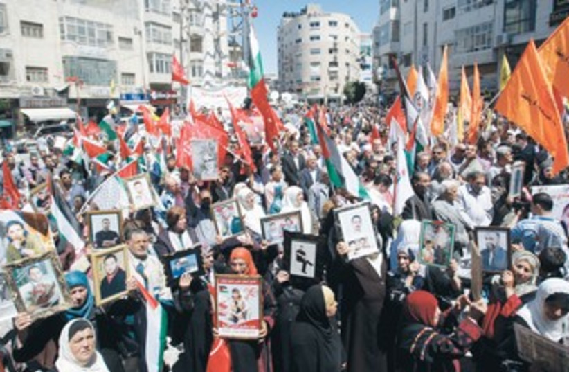 PALESTINIANS RALLY in Ramallah for Prisoners Day 370 (photo credit: Mohamad Torokman/Reuters)