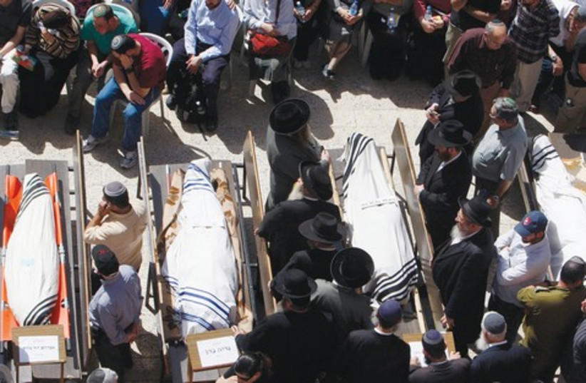 Funeral for victims of Merkaz Harav shooting 521 (photo credit: Reuters)