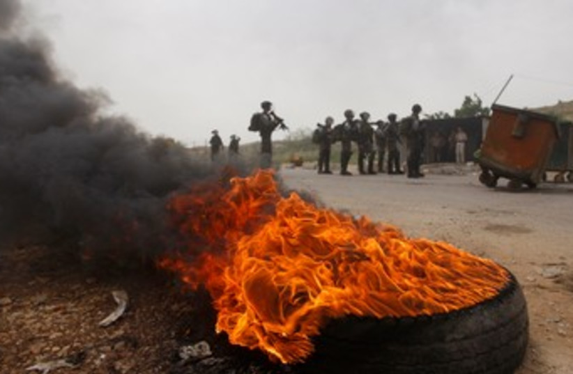 Protests near Ofer Prison 370 (R) (photo credit: REUTERS/Mohamad Torokman)