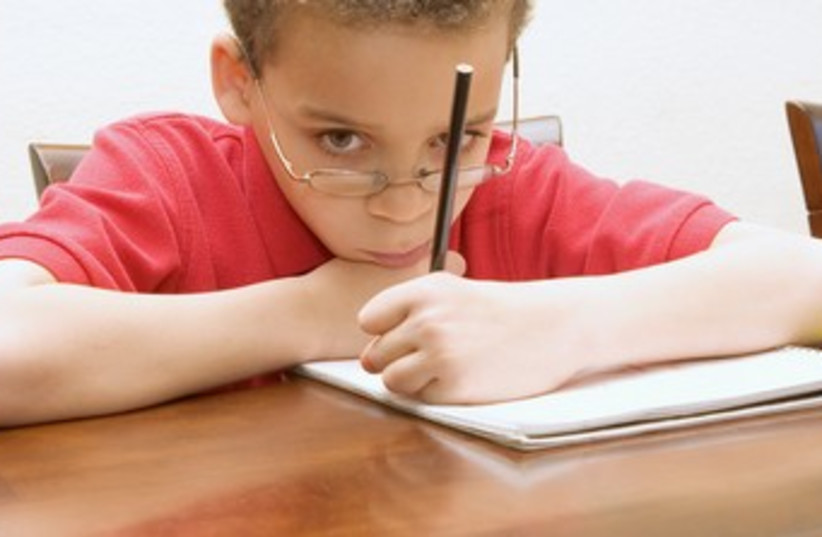 Boy reluctant to do his homework 370 (photo credit: Thinkstock/Imagebank)
