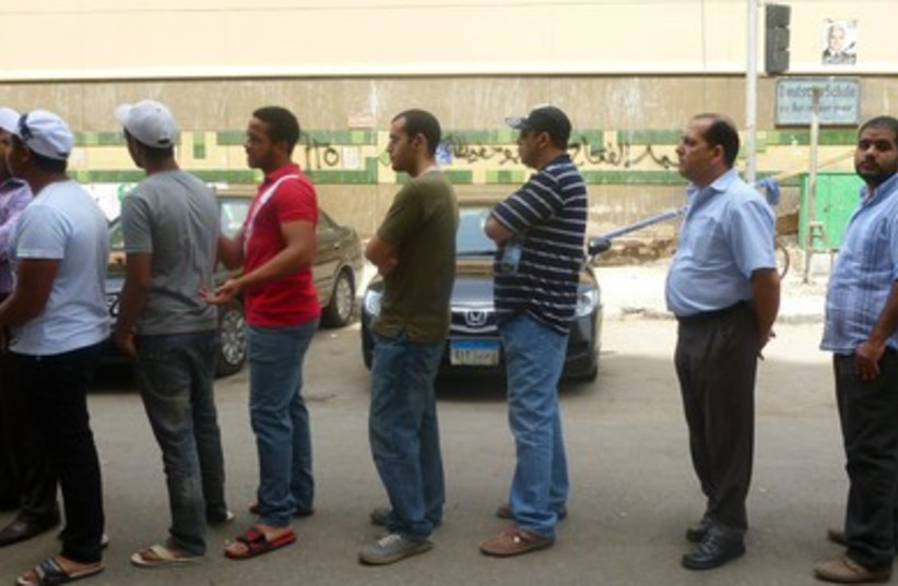 Men standing in line to vote