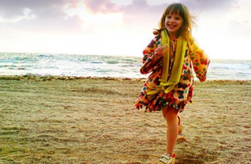 girl running on beach (photo credit: Tom Langford)