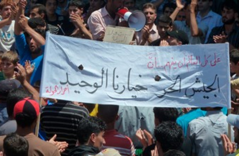 Demonstrators protest against Assad after Friday prayers 370 (photo credit: REUTERS)