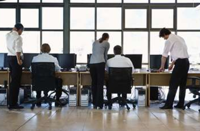 Workers in an office 370 (photo credit: Thinkstock)