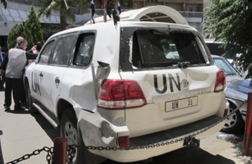 UN vehicle damaged in Syria 370 (photo credit: REUTERS)