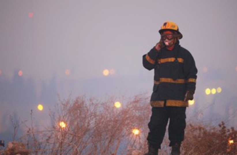 Firefighter during Carmel fire 370 (photo credit: REUTERS)