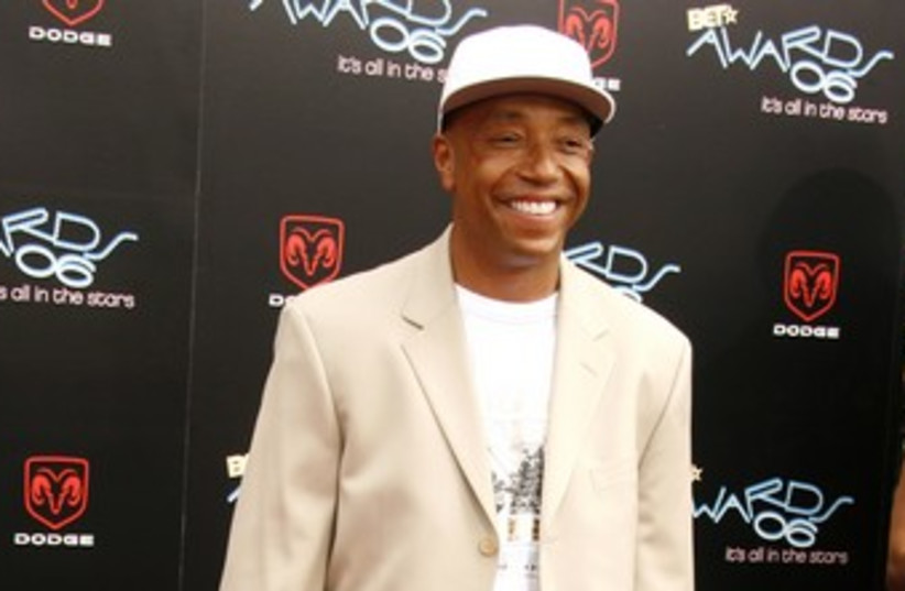 Russell Simmons 370 (R) (photo credit: Fred Prouser / Reuters)