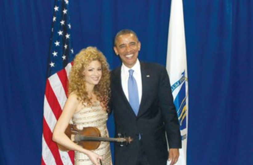 Miri Ben-Ari poses with US President Barack Obama 370 (photo credit: Noam Galai)
