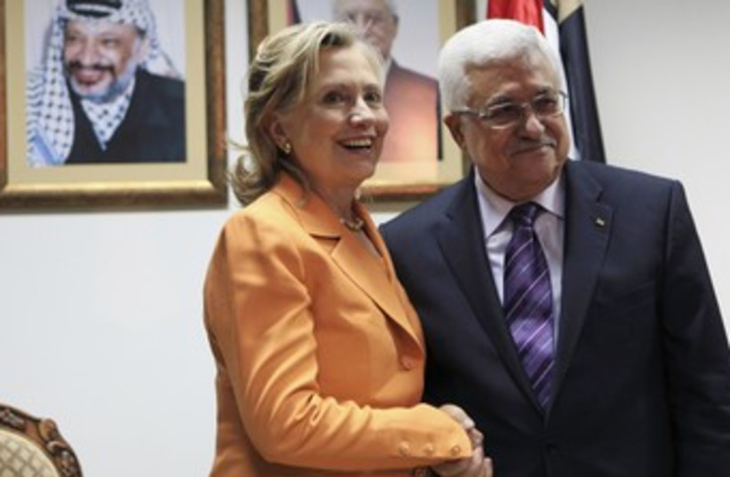 Clinton with Abbas during 2010 Ramallah visit 370 (R) (photo credit: Fadi Arouri / Reuters)