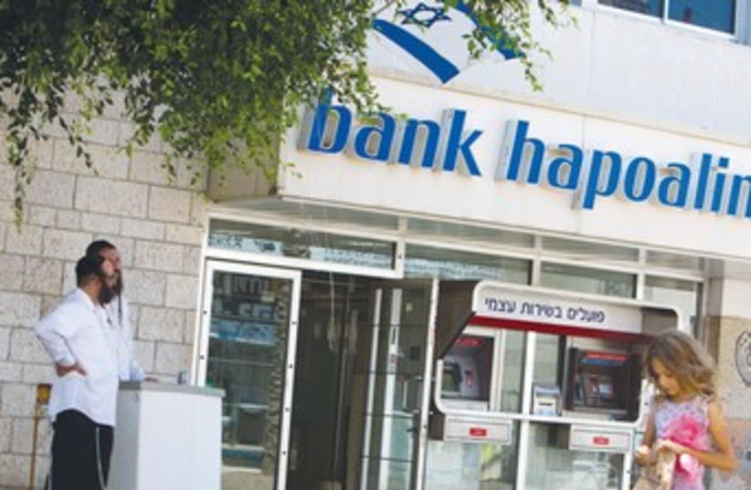 Haredim at Bank Hapoalim 370 (photo credit: Amir Cohen/Reuters)