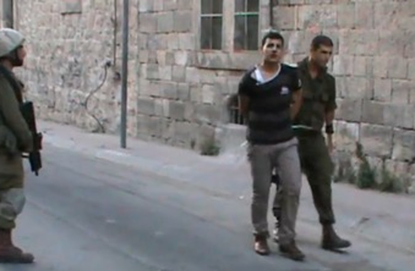B'Tselem video of soldiers, Palestinians in Hebron 370 (photo credit: YouTube Screenshot)