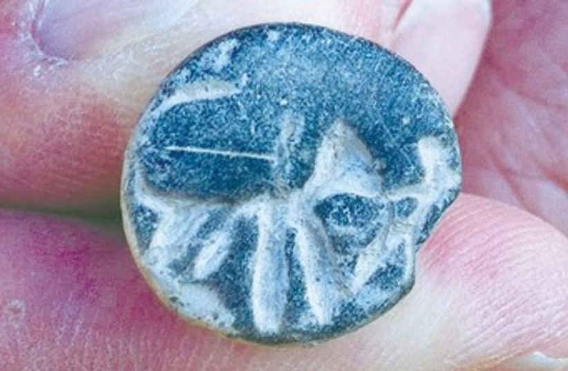 A TWELFTH-CENTURY BCE seal (photo credit: Courtesy of Tel Aviv University)